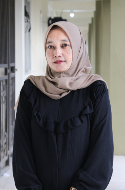 Eva Maria Sandika, S.Pd., Gr.